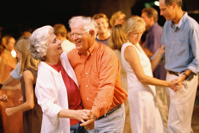 A couple of people that are dancing together